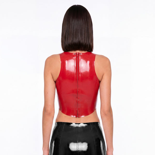 Racer Tank in red latex worn with a black latex mini skirt, back view
